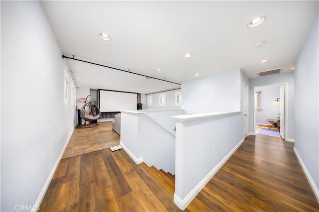 hallway featuring dark hardwood / wood-style floors