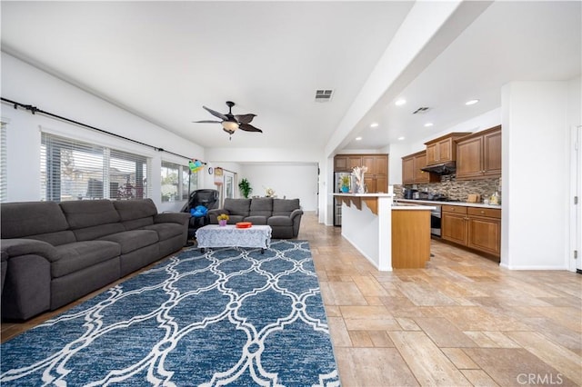 living room with ceiling fan