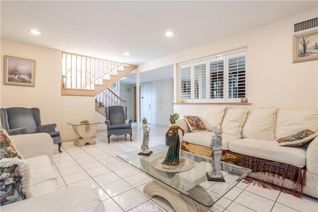 living room featuring recessed lighting, stairs, and light tile patterned flooring