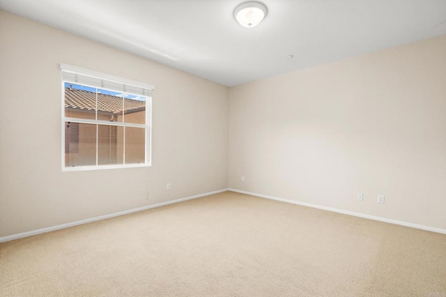 unfurnished room featuring carpet