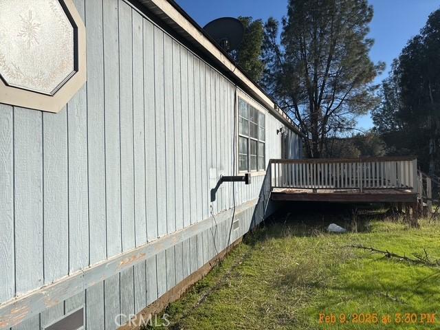 1845 Spring Valley Rd, Clearlake Oaks, CA 95423 - view of side of property with a wooden deck and a yard