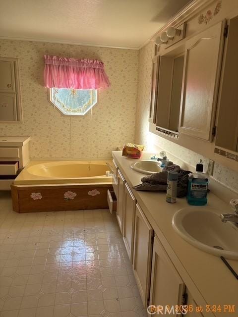 bathroom featuring vanity, a bath, and ornamental molding