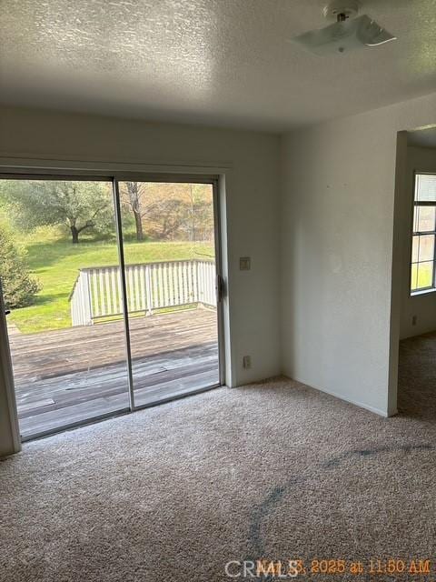 1845 Spring Valley Rd, Clearlake Oaks, CA 95423 - empty room featuring carpet floors, a textured ceiling, and a ceiling fan