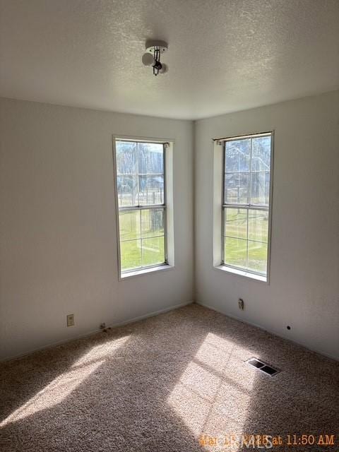 1845 Spring Valley Rd, Clearlake Oaks, CA 95423 - carpeted empty room with healthy amount of natural light and a textured ceiling