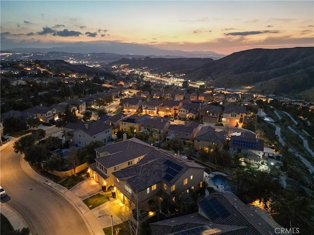 aerial view at dusk with a mountain view