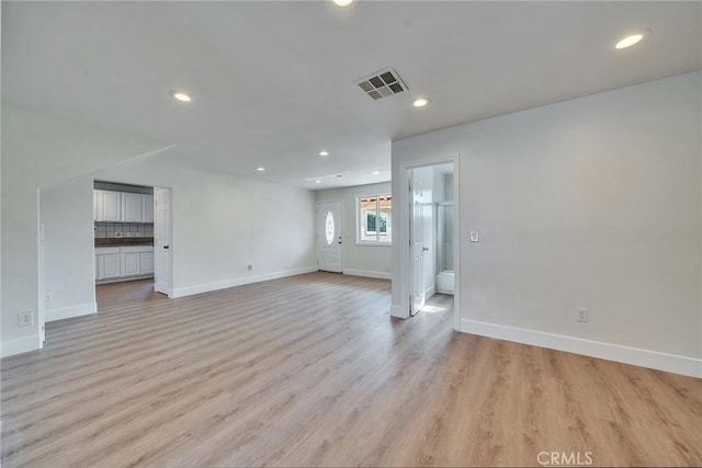 unfurnished room with light hardwood / wood-style floors