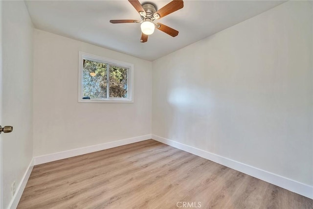 unfurnished room featuring ceiling fan and light wood-type flooring