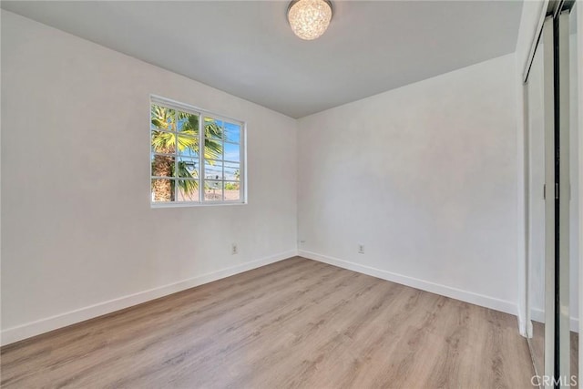 unfurnished room featuring light wood-type flooring