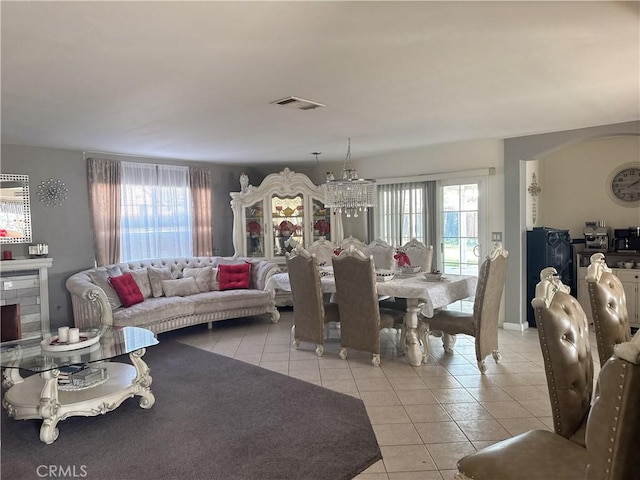 interior space featuring plenty of natural light and a notable chandelier