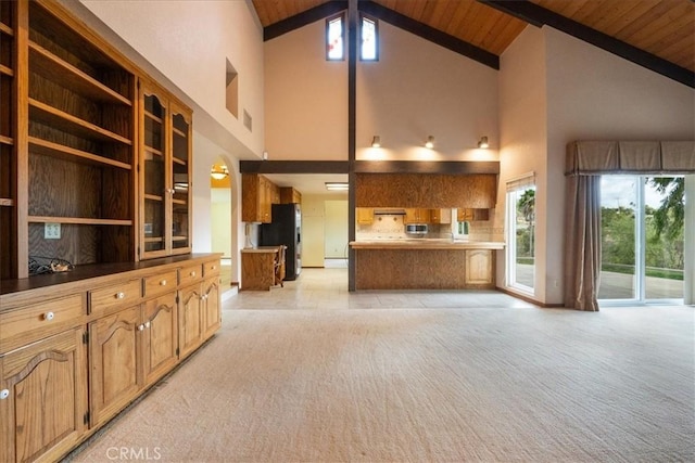 kitchen with light countertops, wooden ceiling, and brown cabinets