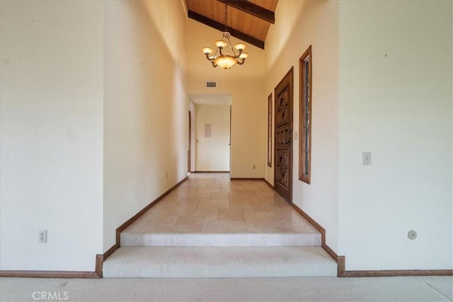 stairway with visible vents, a chandelier, wood ceiling, beamed ceiling, and high vaulted ceiling