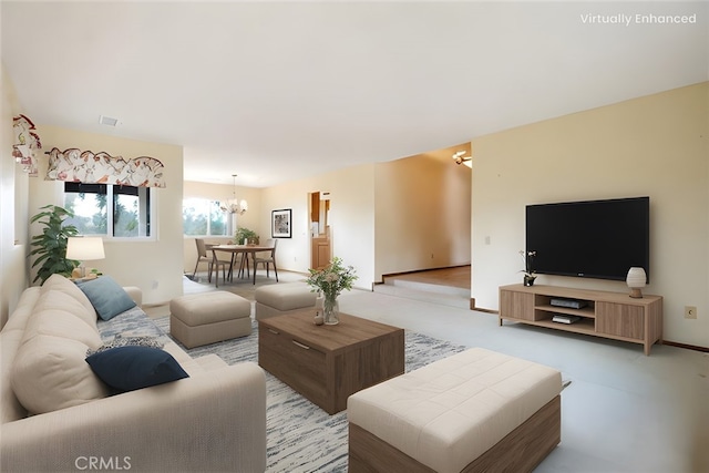 living room with a chandelier, light colored carpet, and visible vents