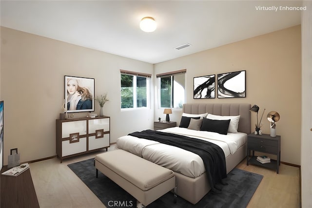 bedroom featuring visible vents and baseboards