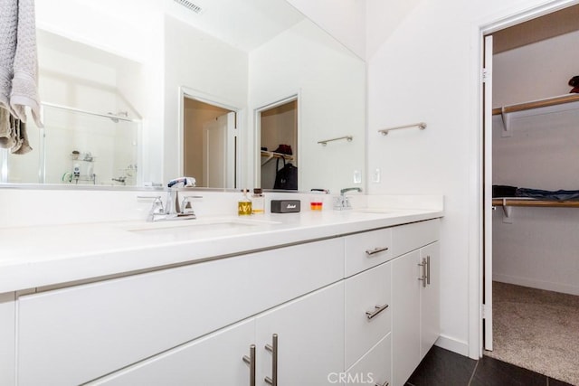 bathroom with vanity and an enclosed shower