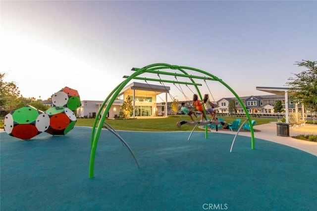 playground at dusk with a yard