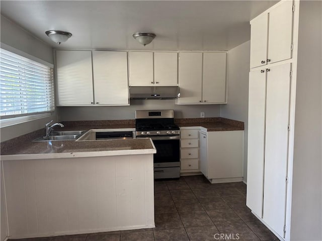 kitchen featuring white cabinetry, sink, gas stove, and kitchen peninsula