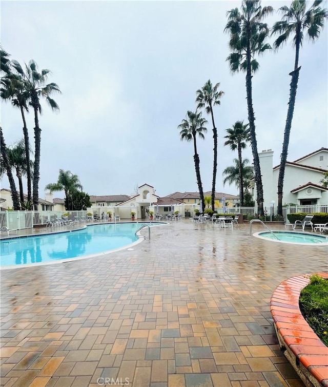 view of swimming pool with a patio