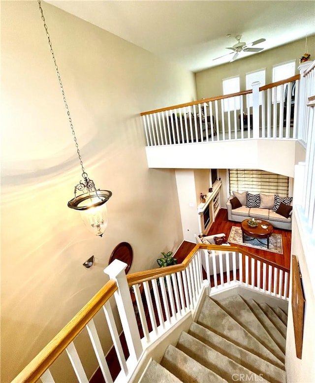 stairway with ceiling fan