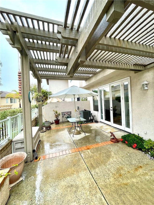 view of patio featuring french doors and a pergola