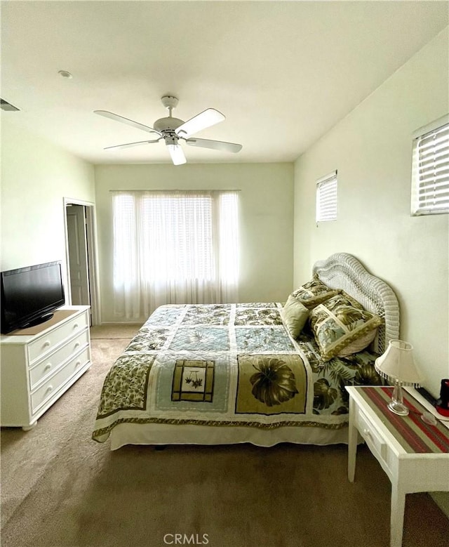 carpeted bedroom featuring ceiling fan