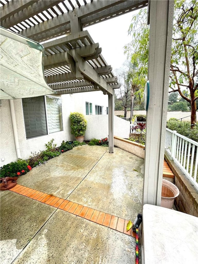 view of patio featuring a pergola