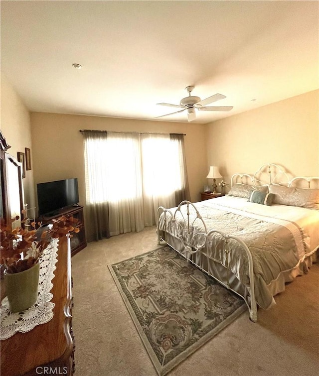 bedroom featuring ceiling fan and carpet flooring