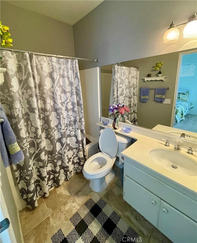 full bathroom featuring vanity, toilet, and shower / bath combo with shower curtain