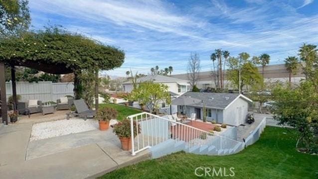 exterior space featuring a yard and a patio