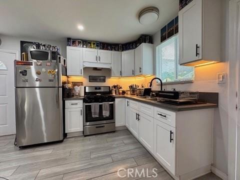 kitchen featuring white cabinetry, appliances with stainless steel finishes, and sink