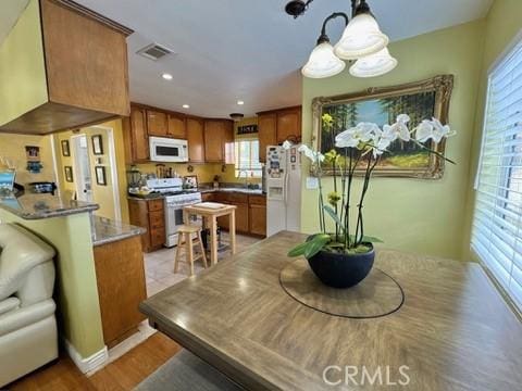 dining area with light wood-type flooring