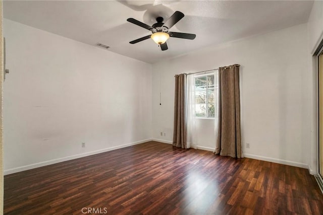 unfurnished room featuring ceiling fan and dark hardwood / wood-style flooring