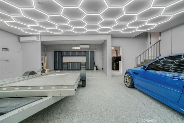 garage featuring an AC wall unit