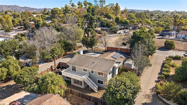 birds eye view of property with a mountain view