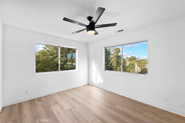 empty room featuring ceiling fan and light wood-type flooring