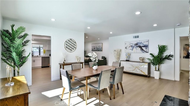 dining room featuring light hardwood / wood-style flooring