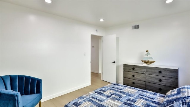 bedroom with light hardwood / wood-style floors