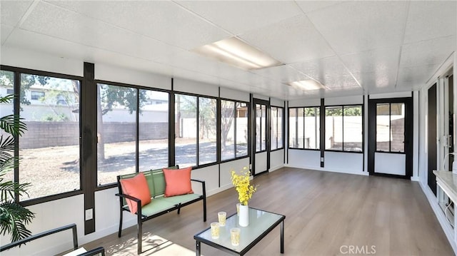 sunroom featuring a drop ceiling