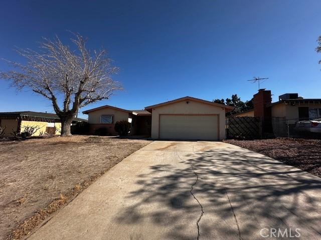 single story home featuring a garage