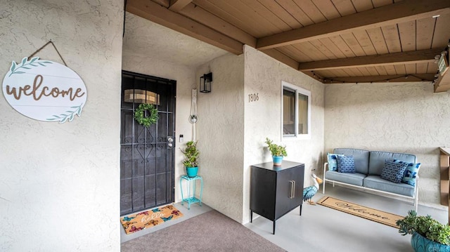 view of exterior entry with stucco siding