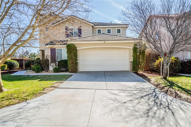 traditional-style home with concrete driveway, stucco siding, a front lawn, a tile roof, and a garage