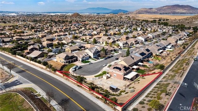 birds eye view of property with a mountain view