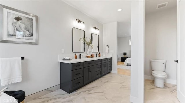 bathroom with vanity and toilet