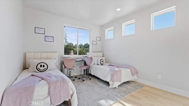 bedroom with light wood-type flooring