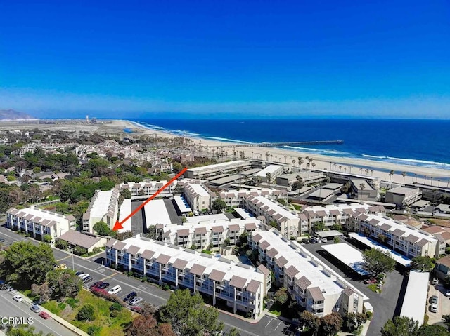 bird's eye view with a water view and a view of the beach