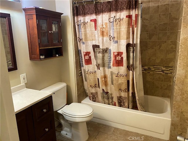 bathroom featuring toilet, tile patterned flooring, shower / tub combo with curtain, and vanity