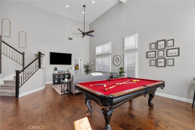 playroom featuring pool table, dark wood-type flooring, ceiling fan, and a high ceiling