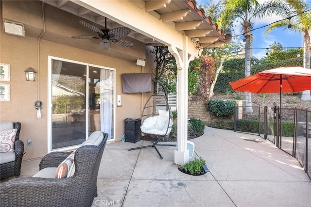 view of patio featuring ceiling fan