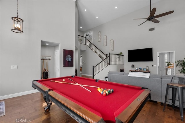 rec room featuring hardwood / wood-style flooring, a towering ceiling, ceiling fan, and billiards