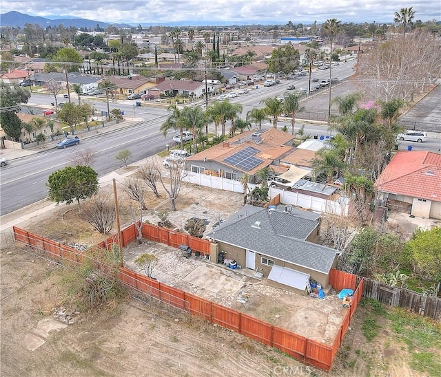 birds eye view of property featuring a mountain view and a residential view