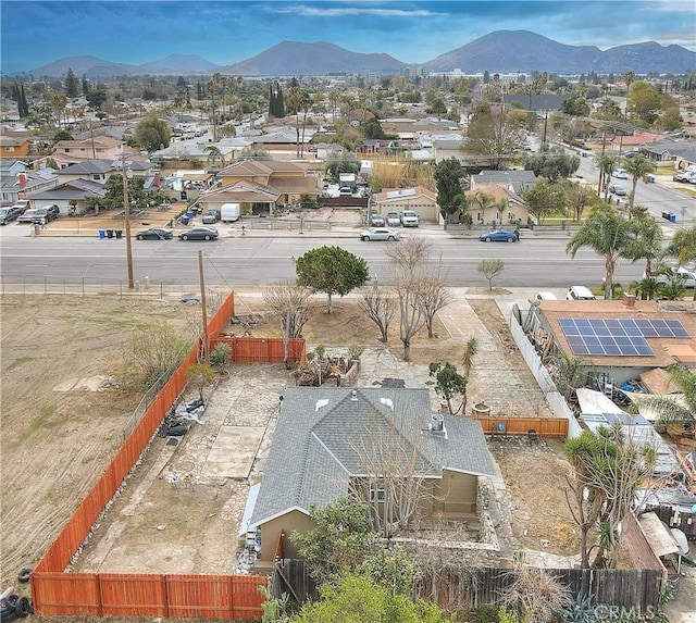 birds eye view of property featuring a mountain view and a residential view